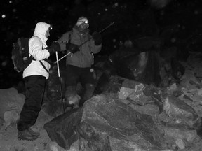 Night-time climb: Mountain guide Kubi adjusts a climbing pole as the expedition makes its way up Mount Ararat at 2:30 in the morning, planning to reach the peak for sunrise. Photo by Rick Antonson.