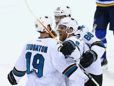 ST LOUIS, MO - MAY 23:  Joe Pavelski #8 of the San Jose Sharks celebrates with Joe Thornton #19 and Brent Burns #88 after scoring a second period goal against the St. Louis Blues in Game Five of the Western Conference Final during the 2016 NHL Stanley Cup Playoffs at Scottrade Center on May 23, 2016 in St Louis, Missouri.  (Photo by Dilip Vishwanat/Getty Images) ORG XMIT: 639706747