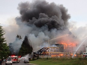 Crews battle a huge fire near Johnston Road and Buena Vista Avenue in the Five Corners area of White Rock on May 15.
