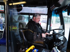 Nelson McCabe demonstrates an experimental bus barrier in New Westminster in 2015. TransLink will be testing a different barrier, used on New York City buses, this summer.