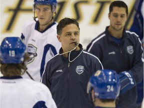 Travis Green prefers to keep running the AHL bench in Utica, for now.
