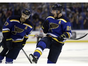 St. Louis Blues' Alexander Steen, right, and teammate Alex Pietrangelo celebrate after the Blues' 3-2 victory over the Chicago Blackhawks in Game 7 of an NHL hockey first-round Stanley Cup playoff series Monday, April 25, 2016, in St. Louis. The Blues won the series 4-3.