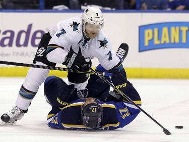 San Jose Sharks defenseman Paul Martin (7) chases the puck against St. Louis Blues left wing Jaden Schwartz (17) during the second period in Game 5 of the NHL hockey Stanley Cup Western Conference finals, Monday, May 23, 2016, in St. Louis. (AP Photo/Jeff Roberson)  ORG XMIT: MOJR115