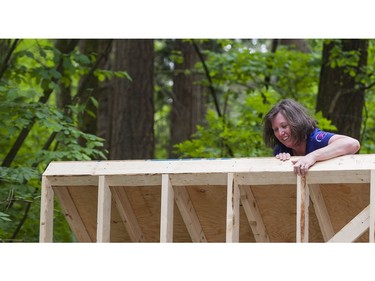 A woman climbs over a wall while taking part in the Woman2Warrior event at Swangard Stadium and Central Park in Burnaby, BC, May, 15, 2016. Funds raised through this all-women charity obstacle adventure race will benefit the BC Lions Society and Easter Seals camps for children with disabilities.