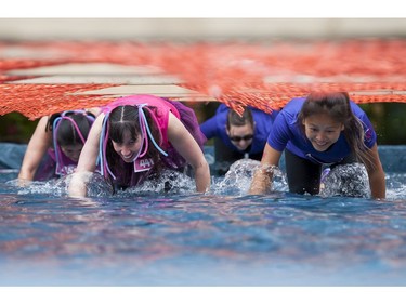 Women take part in the WOMAN2WARRIOR event at Swangard Stadium and Central Park in Burnaby, BC, May, 15, 2016. Funds raised through this all-women charity obstacle adventure race will benefit the BC Lions Society and Easter Seals camps for children with disabilities.