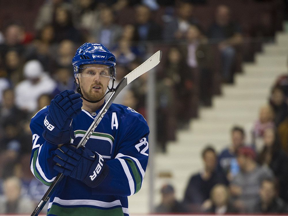 VANCOUVER February 25 2016. Vancouver Canucks #22 Daniel Sedin adjusts his gear during a break in play against the Ottawa Senators in the third period of a regular season NHL hockey game at Rogers Arena, Vancouver, February 25 2016. Gerry Kahrmann / PNG staff photo) / PNG staff photo) ( For Prov / Sun Sports) 00041934A [PNG Merlin Archive]