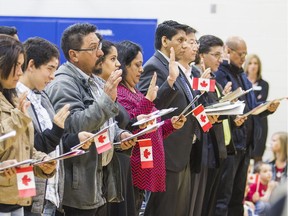 Students from Twenty Valley Public School in Vineland were dressed in red and white as they watched 28 people beome Canadian Citizens during a ceremony Friday April 29, 2016.  Citizen judge Ted Salci led the ceremony, one of over 200 he performs per year in the Hamilton and Niagara Region. Bob Tymczyszyn/St. Catharines Standard/Postmedia Network