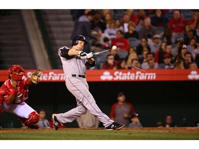 Justin Morneau of the Colorado Rockies breaks his bat during the sixth inning against the Los Angeles Angels at Angel Stadium on May 12, 2015.