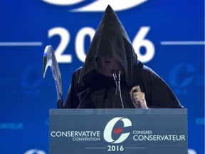 Conservative MP Marilyn Gladu addresses the crowd dressed as the grim reaper at the Conservative Party of Canada convention in Vancouver, Friday, May 27, 2016.
