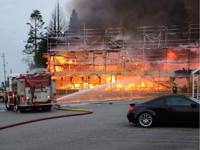 Fire crews in White Rock have spent several hours fighting a fire believed to have started in a condominium construction site early Sunday.