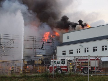 Crews battle a huge fire near Johnston Road and Buena Vista Avenue in the Five Corners area of White Rock Sunday May 15.