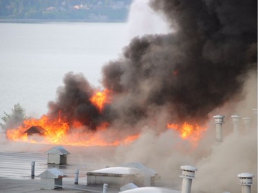 Crews battle a huge fire near Johnston Road and Buena Vista Avenue in the Five Corners area of White Rock Sunday May 15. [PNG Merlin Archive]