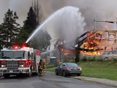 Crews battle a huge fire near Johnston Road and Buena Vista Avenue in the Five Corners area of White Rock Sunday May 15.