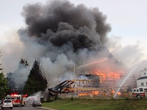 Crews battle a huge fire near Johnston Road and Buena Vista Avenue in the Five Corners area of White Rock Sunday May 15.