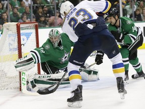 St. Louis Blues right wing Dmitrij Jaskin (23) scores a goal against Dallas Stars goalie Kari Lehtonen (32) and left wing Jamie Benn (14) during the second period of Game 5 of the NHL hockey Stanley Cup playoffs Western Conference semifinals Saturday, May 7, 2016, in Dallas.