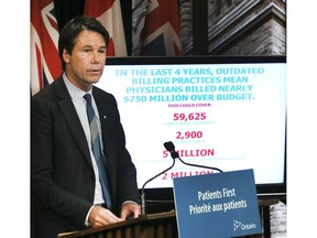Dr. Eric Hoskins, Minister of Health and Long-Term Care at a press conference in Toronto.