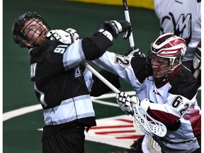 Cory Conway, playing for the Edmonton Rush in 2015, gets a glove in the chin courtesy of Colorado Mammoth's Creighton Reid. When will Conway, now starring for the Victoria Shamrocks in the WLA, return to the NLL?