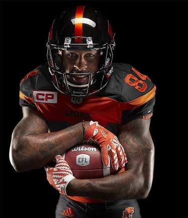 Receiver Emmanuel Arceneaux models the B.C. Lions’ new adidas-produced home jersey and helmet for the 2016 CFL season, part of a league-wide revamp of team uniforms.