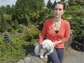 Vancouver-based veterinarian Anna Wallace, seen here with her healthy dog Madeline, typically sees one marijuana-toxicity case a month.