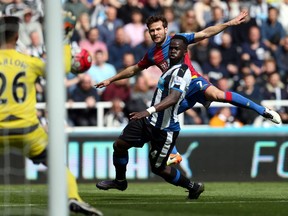 Crystal Palace midfielder Yohan Cabaye, right, fires a shot past Newcastle United midfielder Cheick Tiote, foreground, during the English Premier League match at St James' Park in Newcastle-upon-Tyne, northeast England, on April 30. — Getty Images