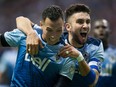 Vancouver Whitecaps' Blas Perez, left, and Pedro Morales celebrate Perez's second goal against the Chicago Fire during the second half of an MLS soccer game in Vancouver, B.C., on Wednesday May 11, 2016.