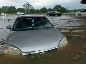 Find yourself suddenly in too deep on a flooded road? Here's what you can do to limit the damage to your car.