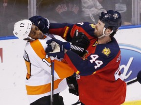 Defenceman Erik Gudbranson (r) was acquired by the Vancouver Canucks in a trade with the Panthers on Wednesday night.