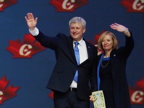 Stephen and Laureen Harper wave to the crowd at the Vancouver Convention Centre.