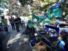 The provincial government announced today that it has bought a former downtown care home to help house homeless people in Victoria, including those at the tent city (pictured).