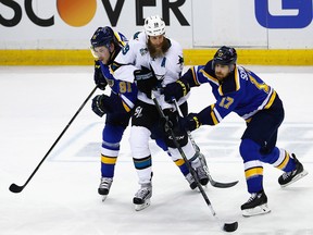 ST LOUIS, MO - MAY 15:  Joe Thornton #19 of the San Jose Sharks skates against Vladimir Tarasenko #91 of the St. Louis Blues and Jaden Schwartz #17 during the first period in Game One of the Western Conference Final during the 2016 NHL Stanley Cup Playoffs at Scottrade Center on May 15, 2016 in St Louis, Missouri.  (Photo by Jamie Squire/Getty Images)