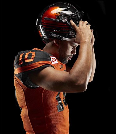 Quarterback Jonathon Jennings models the B.C. Lions’ new adidas-produced home jersey and helmet for the 2016 CFL season, part of a league-wide revamp of team uniforms.