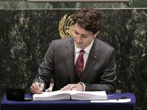 Justin Trudeau signs the Paris Agreement on climate change in April.