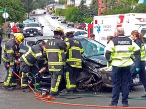 First responders attend to a crash in Kamloops on Friday, May 27, 2016. Two occupants of one of the wrecked cars stole the vehicle of a passerby.