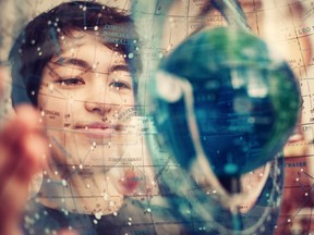 UBC undergrad-astronomy student Michelle Kunimoto holds a celestial sphere, showing the stars as they appear in our skies. She has added four new planets to the map  of  the sky, including a  system that might be an abode for life.