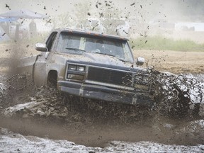 A truck tackles a mud pit at the Stave Lake mudflats north of Mission. A jeep gets stuck in a mud pit on the flats at Stave Lake, north of Mission, where hundreds regularly assemble to test their off-road vehicles and party.
