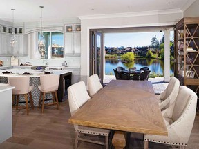 Folding glass doors open up the dining area to the patio at the Hometown Heroes Lottery prize home in Morgan Creek.