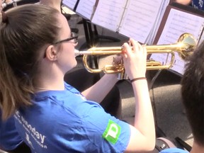 A student plays a trumpet at Music Monday, held May 2 at Robson Square in Vancouver.
