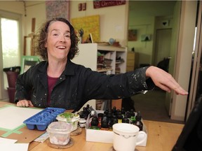 NORTH VANCOUVER, BC., May 30, 2016 -- Deaf artist AJ Brown in action at home in North Vancouver, BC., May 30, 2016. She's totally deaf and can't really speak; she has cerebral palsy and has metal rods in her spine because of surgery to correct a severe lateral curvature. Yet she graduated from university with a degree in English lit and music and is now an accomplished artist.(Nick Procaylo/PNG)   00043439A   [PNG Merlin Archive]