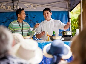 Nathan Fong, left, the lead guest chef and emcee at the Comox by the Sea celebration demonstration stage, during the B.C. Shellfish & Seafood Festival. He is pictured with Chef Quang Dang.