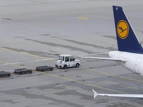 A Lufthansa plane is parked at the airport in Munich, Germany, Wednesday, April 27, 2016. Lufthansa officials say a Vancouver-bound flight from Munich was diverted to Hamburg after a passenger suffered a medical issue.