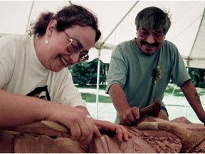 File photo: Norman Tait, and his student, Lucinda Turner (left) work a totem pole on the PNE site.