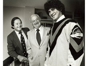 Rick Vaive, shown with coach Harry Neale, left, and general manager Jake Milford, was one of Vancouver's better top-five draft picks, fifth overall in 1979. But he played just 47 games for the Canucks before he was traded to Toronto in the Tiger Williams deal. — PNG files