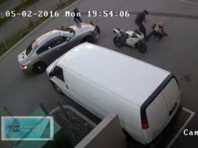 Surveillance video from a Fraser Street business shows police arresting a motorcyclist.