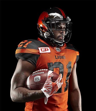 Defensive back Ryan Phillips models the B.C. Lions’ new adidas-produced home jersey and helmet for the 2016 CFL season, part of a league-wide revamp of team uniforms.