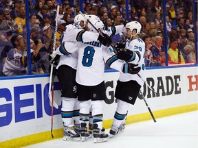 ST LOUIS, MO - MAY 17:  Brent Burns #88 of the San Jose Sharks celebrates with Joe Thornton #19, Joe Pavelski #8, and Logan Couture #39 after scoring a second period goal against Brian Elliott #1 of the St. Louis Blues in Game Two of the Western Conference Final during the 2016 NHL Stanley Cup Playoffs at Scottrade Center on May 17, 2016 in St Louis, Missouri.