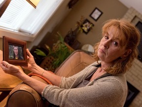 Sandra Tully with a photo of her son, Ryan Pinneo, who died after taking pills laced with fentanyl. [PNG Merlin Archive]
