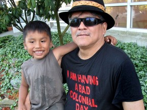 Seen here with grandson Talon, Lawrence Paul Yuxweluptun will open a solo painting exhibition at the Museum of Anthropology May 10.