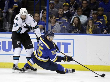 San Jose Sharks center Patrick Marleau (12) fouls on St. Louis Blues defenseman Colton Parayko (55) during the third period in Game 5 of the NHL hockey Stanley Cup Western Conference finals, Monday, May 23, 2016, in St. Louis. (AP Photo/Jeff Roberson)  ORG XMIT: MOJR125