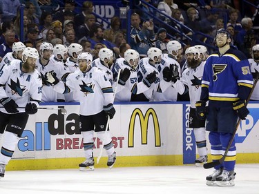 San Jose Sharks center Joe Pavelski (8) celebrates with teammates after scoring a goal during the second period in Game 5 of the NHL hockey Stanley Cup Western Conference finals, Monday, May 23, 2016, in St. Louis. At right is St. Louis Blues defenseman Colton Parayko (55). (AP Photo/Jeff Roberson)  ORG XMIT: MOJR121