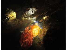 Six months after being entrapped on this Cascade Cave ledge because of high water, Duncan cavers Andrew Munoz and Jason Storie re-create where they sheltered in place on Vancouver Island for 14 scary hours.